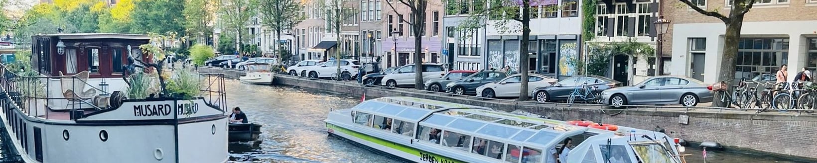 Boats on a canal in Amsterdam